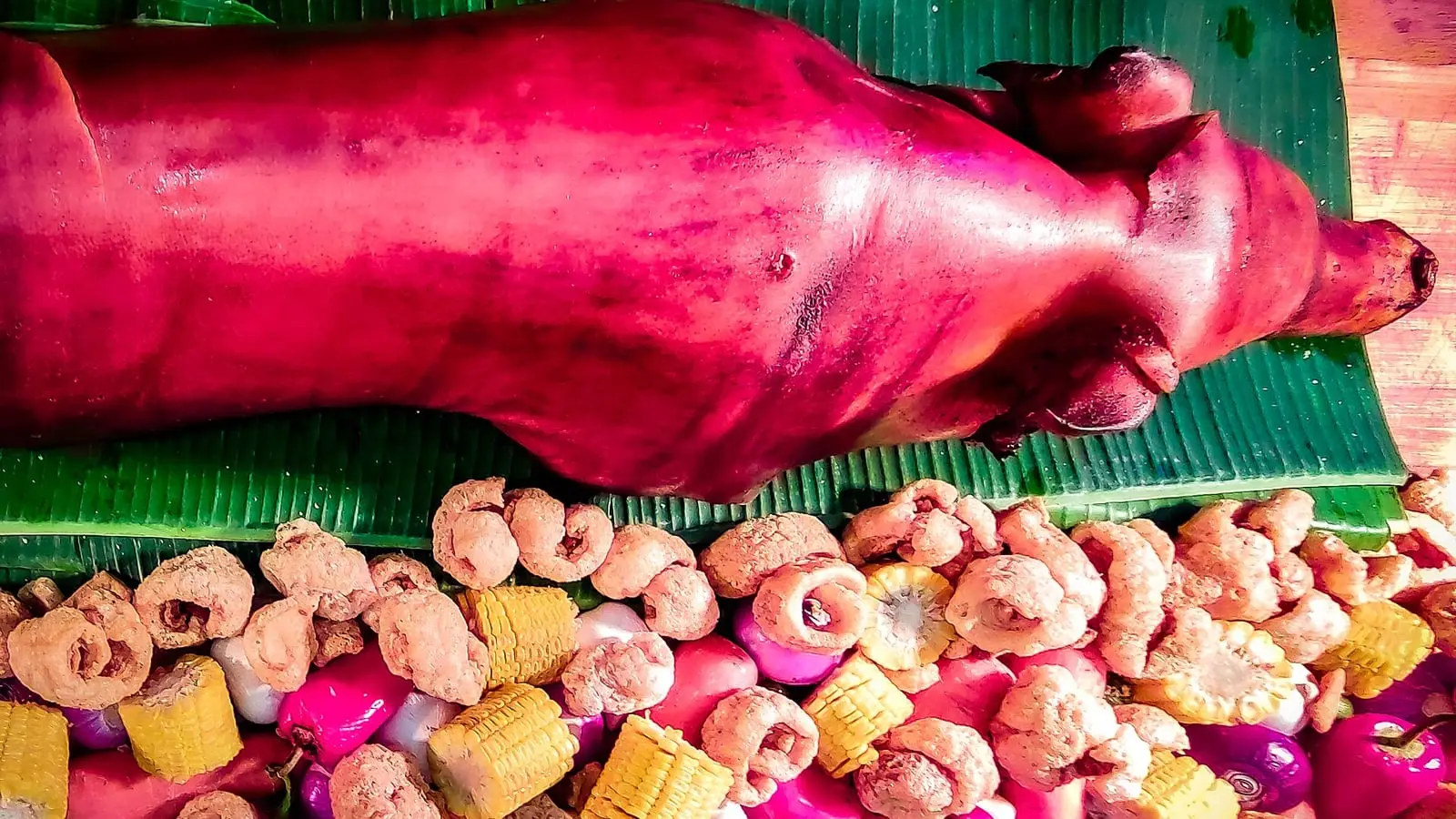 Crispy-skinned Cebu lechon roast pork paired with sweet tropical Philippine mangoes and coastal seafood