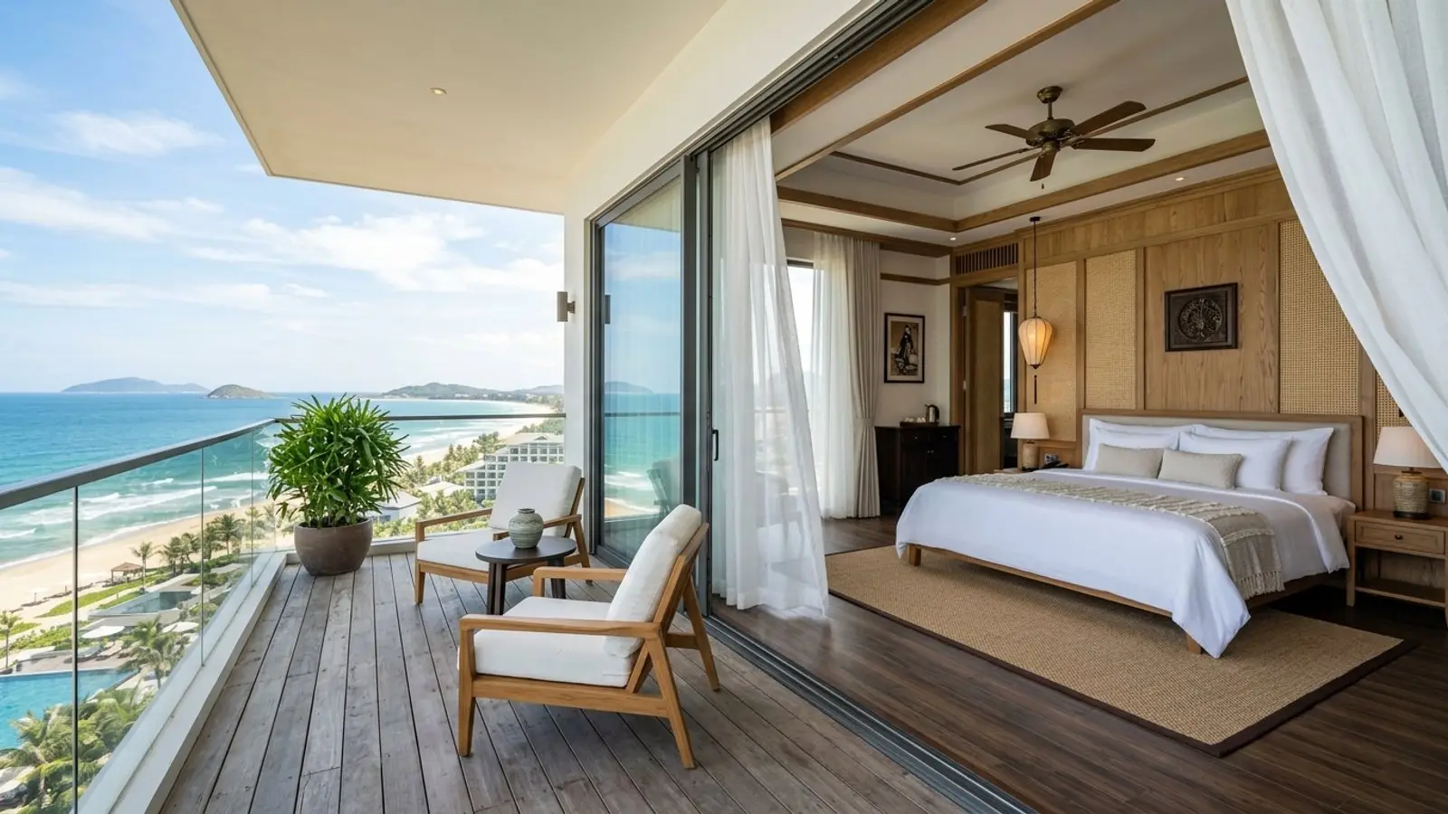 Indochine-inspired oceanfront suite with private terrace framing sweeping East Sea horizons in Da Nang