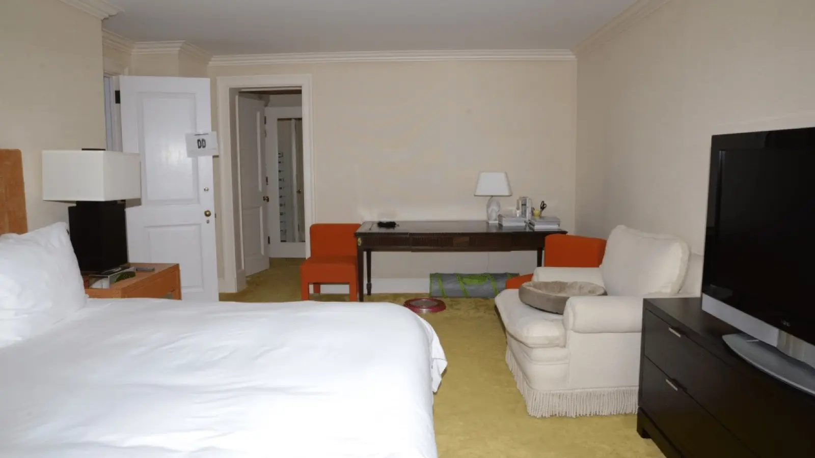 Hotel desk workspace verifying final checkout currency and taxes