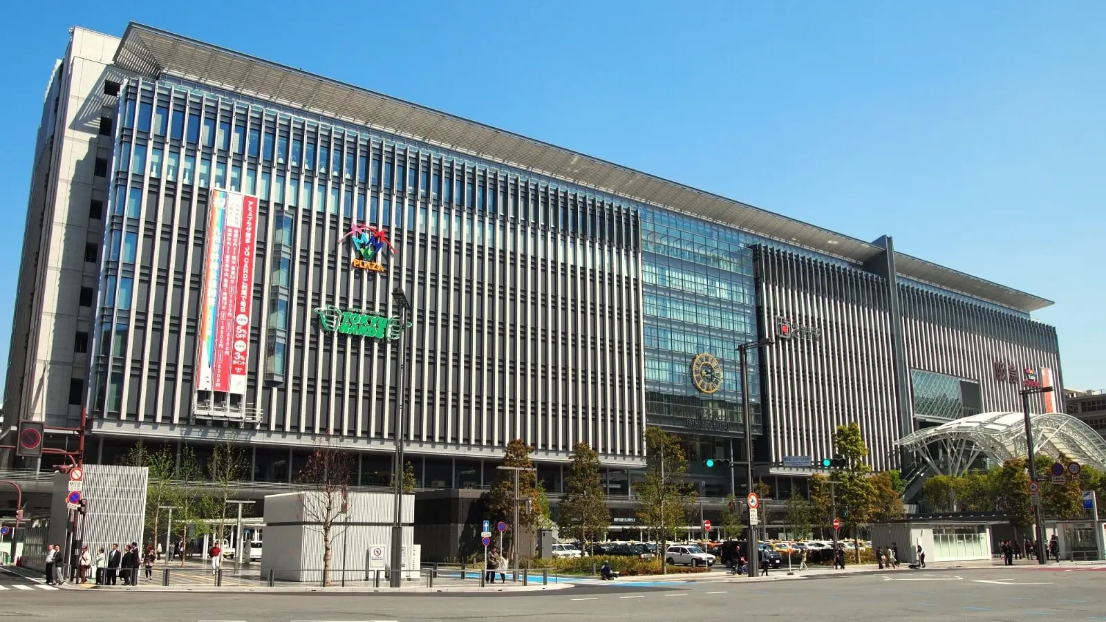 Lively urban square and grand architectural facade of JR Hakata City at Hakata Exit