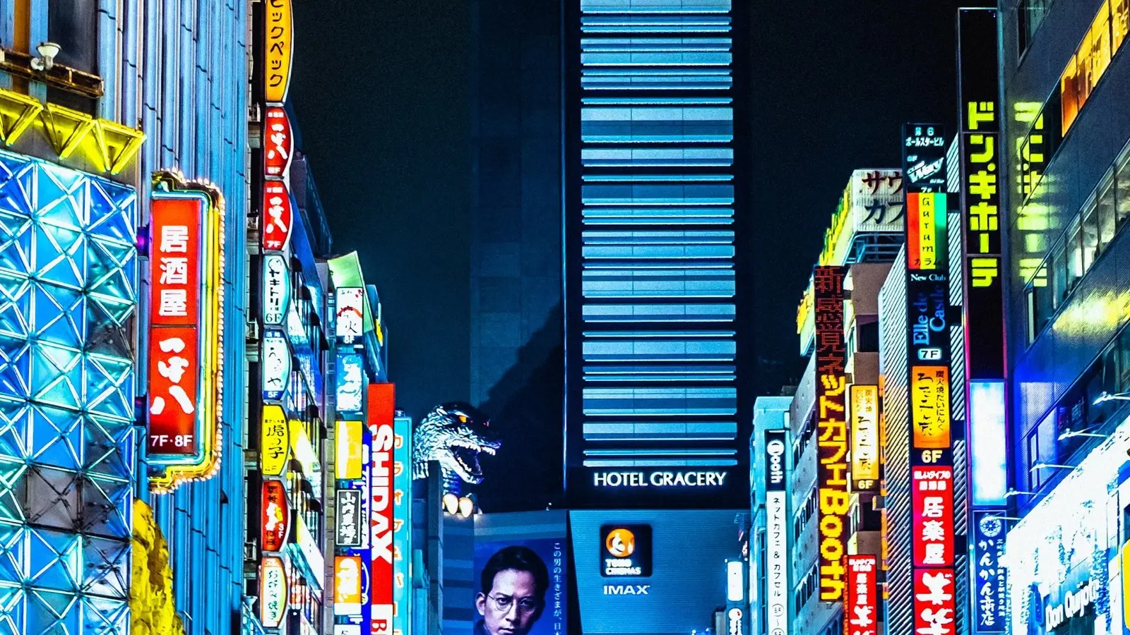 Traveler checking local bus routes and hotel locations outside Kyoto Station central exit bus terminal