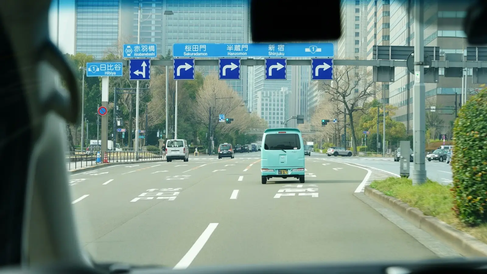 Electronic Toll Collection (ETC) expressway gantry and bilingual highway signs across the Kyushu road network