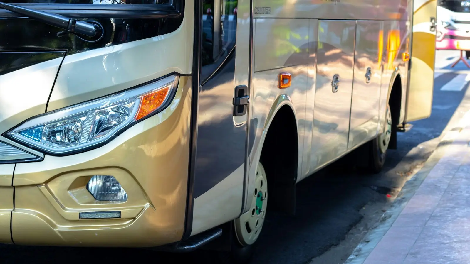 Distinctive taxis and ride-hailing vehicles navigating heavy urban traffic across central Bangkok and European boulevards