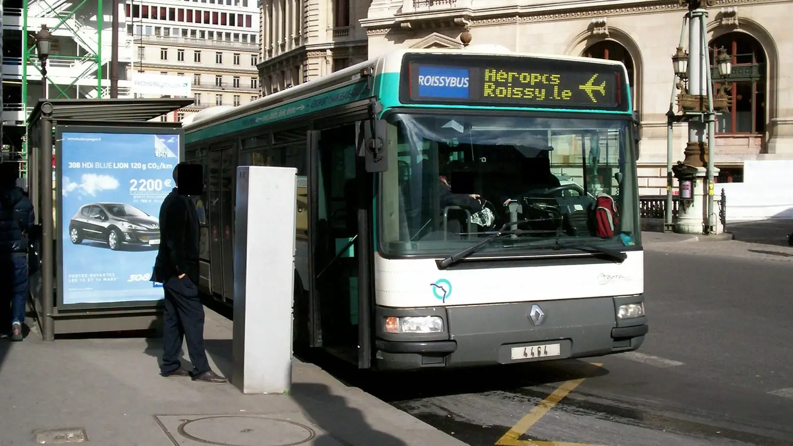 Direct RoissyBus airport express coach stationed beside Palais Garnier Opera in central Paris