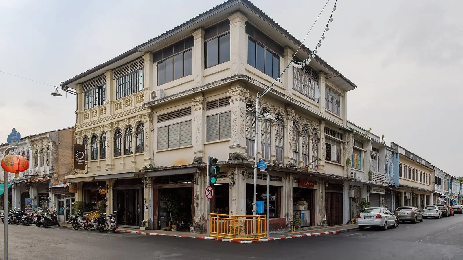 Pastel-painted Sino-Portuguese shophouses and arched walkways along Thalang Road in Old Phuket Town
